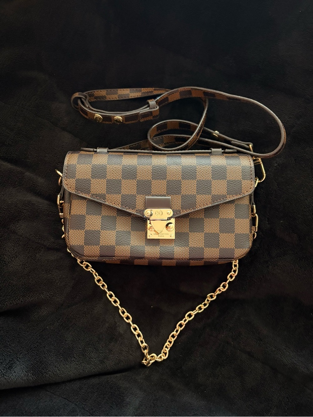 Brown Louis Vuitton crossbody purse